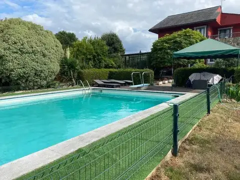 Piscina y casa
